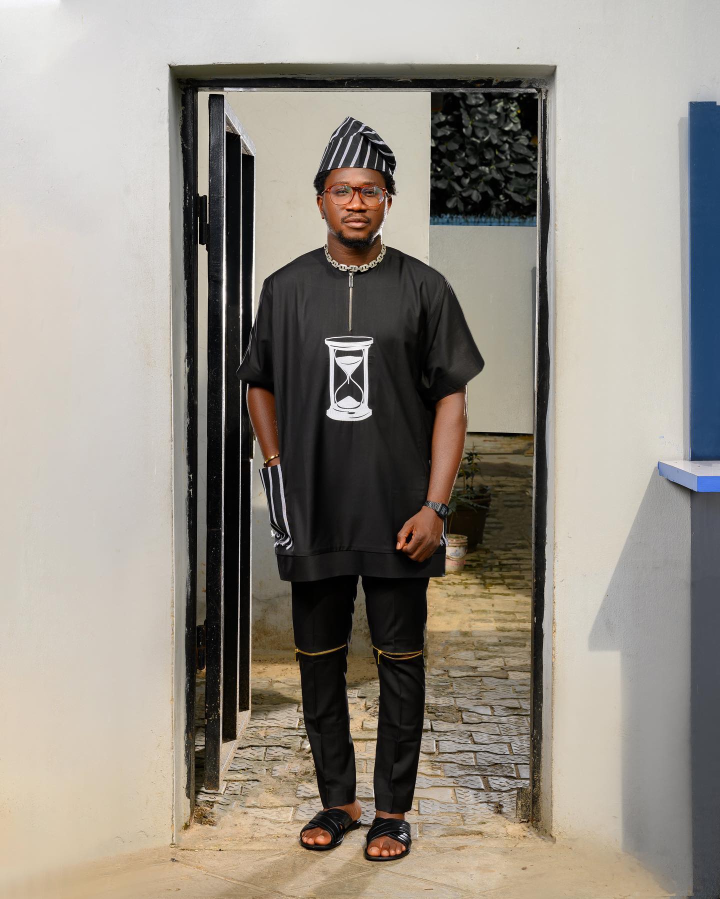 Black Short Sleeve Casual with an hour-glass embroidery pattern and a stripe Fila Cap