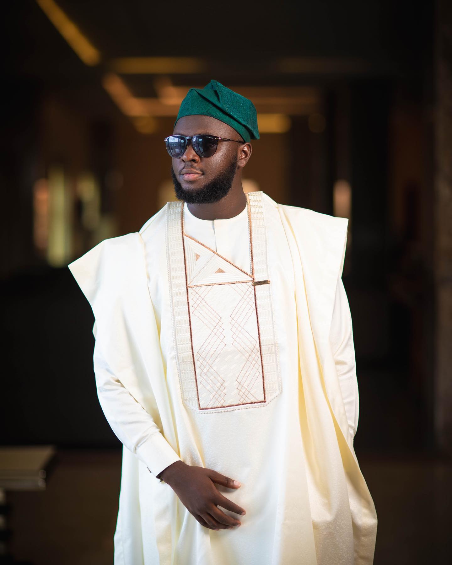 Cream Full Sleeve Agbada with a blend of lemon Green Embroidery pattern and a matching Fila Cap